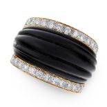 A VINTAGE ONYX AND DIAMOND RING in 18ct yellow gold, the tapering band set with a reeded carved