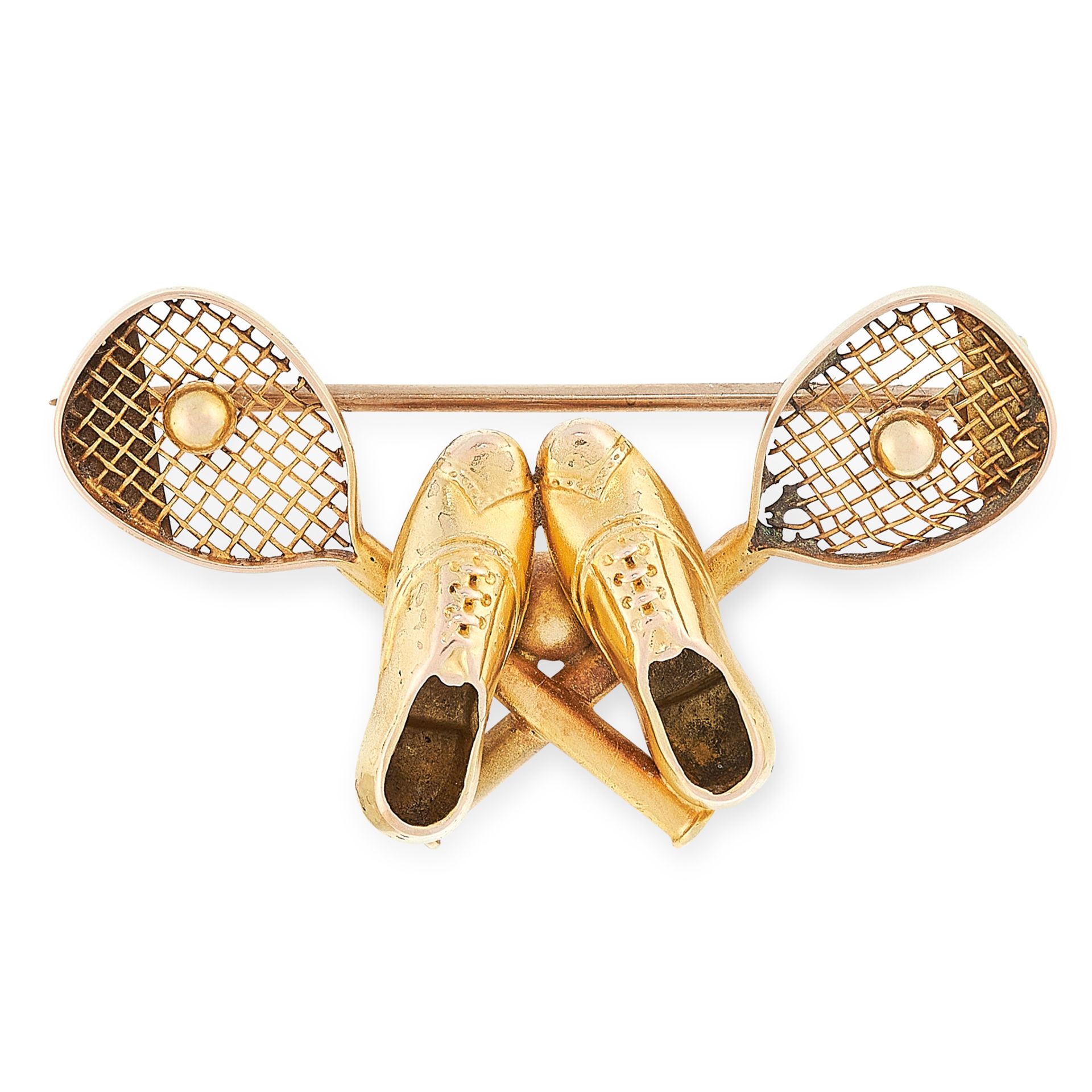 AN ANTIQUE TENNIS BROOCH in high carat yellow gold, designed as two overlapping tennis rackets, with