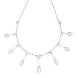 A MOONSTONE FRINGE NECKLACE, EARLY 20TH CENTURY in yellow world, the belcher link chain suspending a
