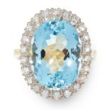 AN AQUAMARINE AND DIAMOND DRESS RING in 18ct yellow and white gold, set with an oval cut