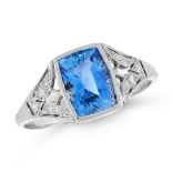 A SAPPHIRE AND DIAMOND DRESS RING set with a cushion cut blue sapphire of 1.85 carats, between