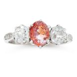 A PADPARADSCHA SAPPHIRE AND DIAMOND RING in 18ct white gold, set with an oval cut padparadscha