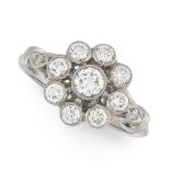 A DIAMOND DRESS RING in platinum, designed as a floral cluster set with round cut diamonds, with