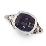 A PURPLE SPINEL AND DIAMOND RING in platinum, set with a cushion cut spinel of 3.32 carats, accented