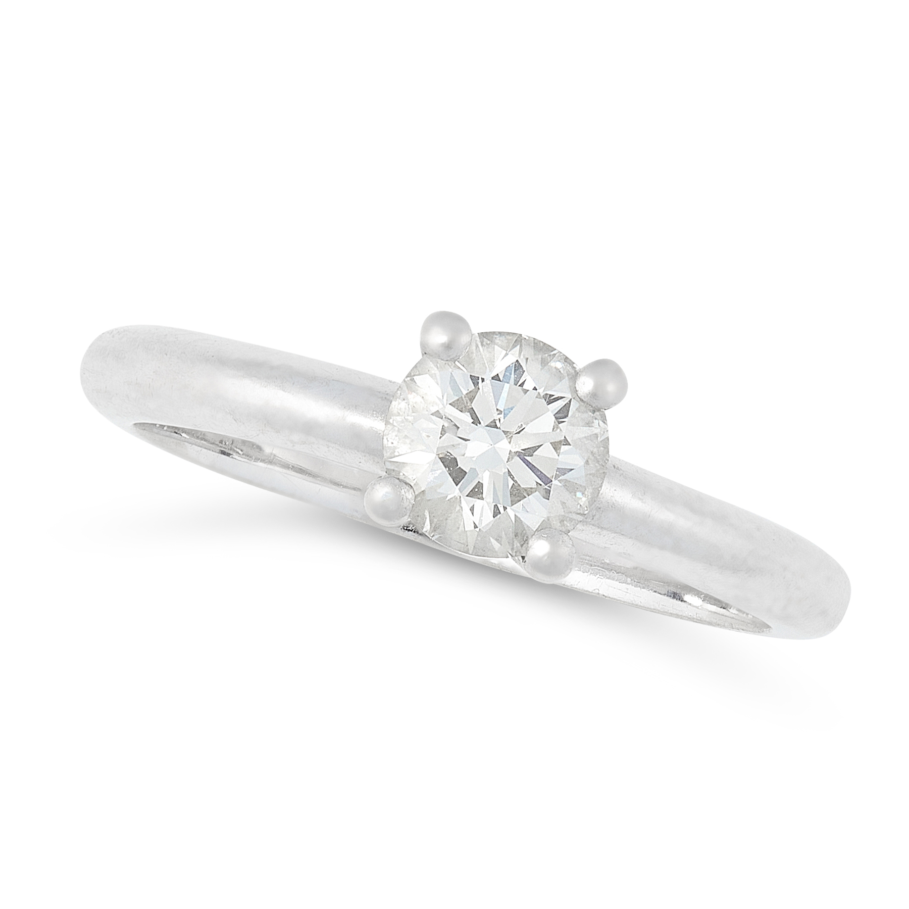 A DIAMOND SOLITAIRE RING in platinum, set with a round cut diamond of 0.53 carats, full British