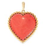 A VINTAGE CORAL PENDANT in high carat yellow gold, set with a large polished piece of coral in the