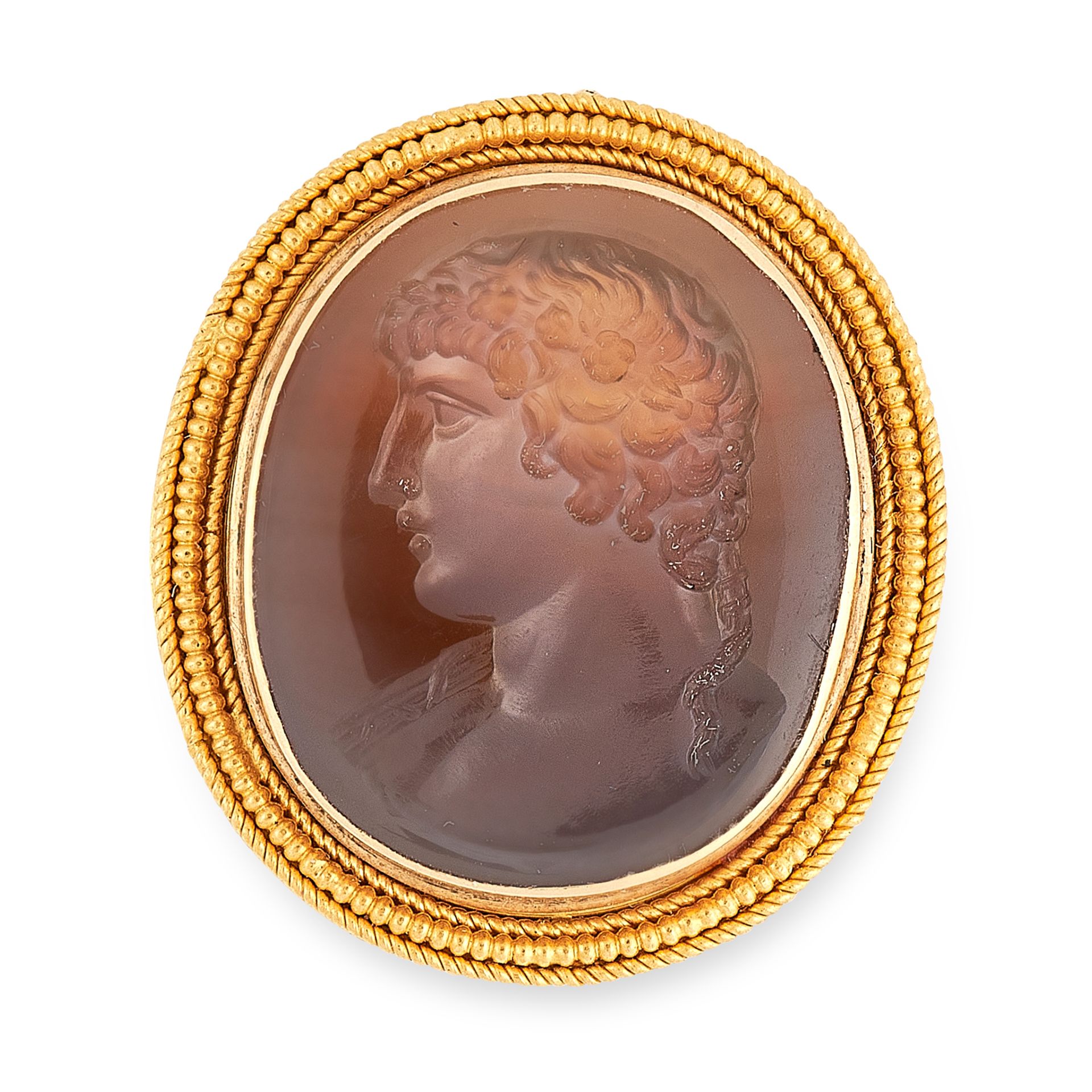 AN ANTIQUE INTAGLIO SEAL BROOCH in high carat yellow gold, the oval face set with a carved hardstone