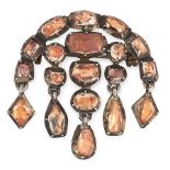 AN ANTIQUE TOPAZ BROOCH, PORTUGUESE CIRCA 1800 in silver, the body close set with variously cut