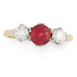 A RUBY AND DIAMOND DRESS RING in yellow gold, set with a round cut ruby of 1.10 carats between two