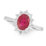 A RUBY AND DIAMOND RING in 18ct white gold, set with an oval cut ruby of 1.89 carats within a border