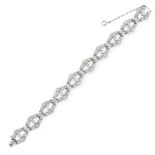 A DIAMOND BRACELET, CIRCA 1940 formed of openwork links set with round and single cut diamonds