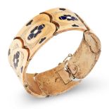 AN ANTIQUE ENAMEL BRACELET, 19TH CENTURY in 14ct yellow gold, with engraved foliate motifs