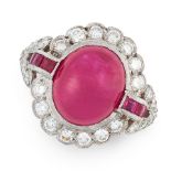 A RUBY AND DIAMOND DRESS RING in platinum, set with an oval cabochon ruby of 7.15 carats, flanked by