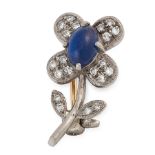 A SAPPHIRE AND DIAMOND FLOWER BROOCH in yellow and white gold, designed as a flower, set with an