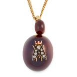 AN ANTIQUE DIAMOND AND GARNET FLY MOURNING LOCKET PENDANT, 19TH CENTURY in yellow gold and silver,