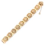 A RETRO FANCY LINK BRACELET, CRICA 1945 in 18ct yellow gold, formed of alternating bevelled and
