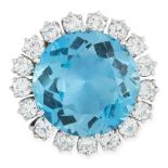 AN AQUAMARINE AND DIAMOND DRESS RING set with a round cut aquamarine of 19.35 carats within a border