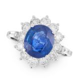 A SAPPHIRE AND DIAMOND CLUSTER RING set with an oval cut blue sapphire of 3.13 carats within a