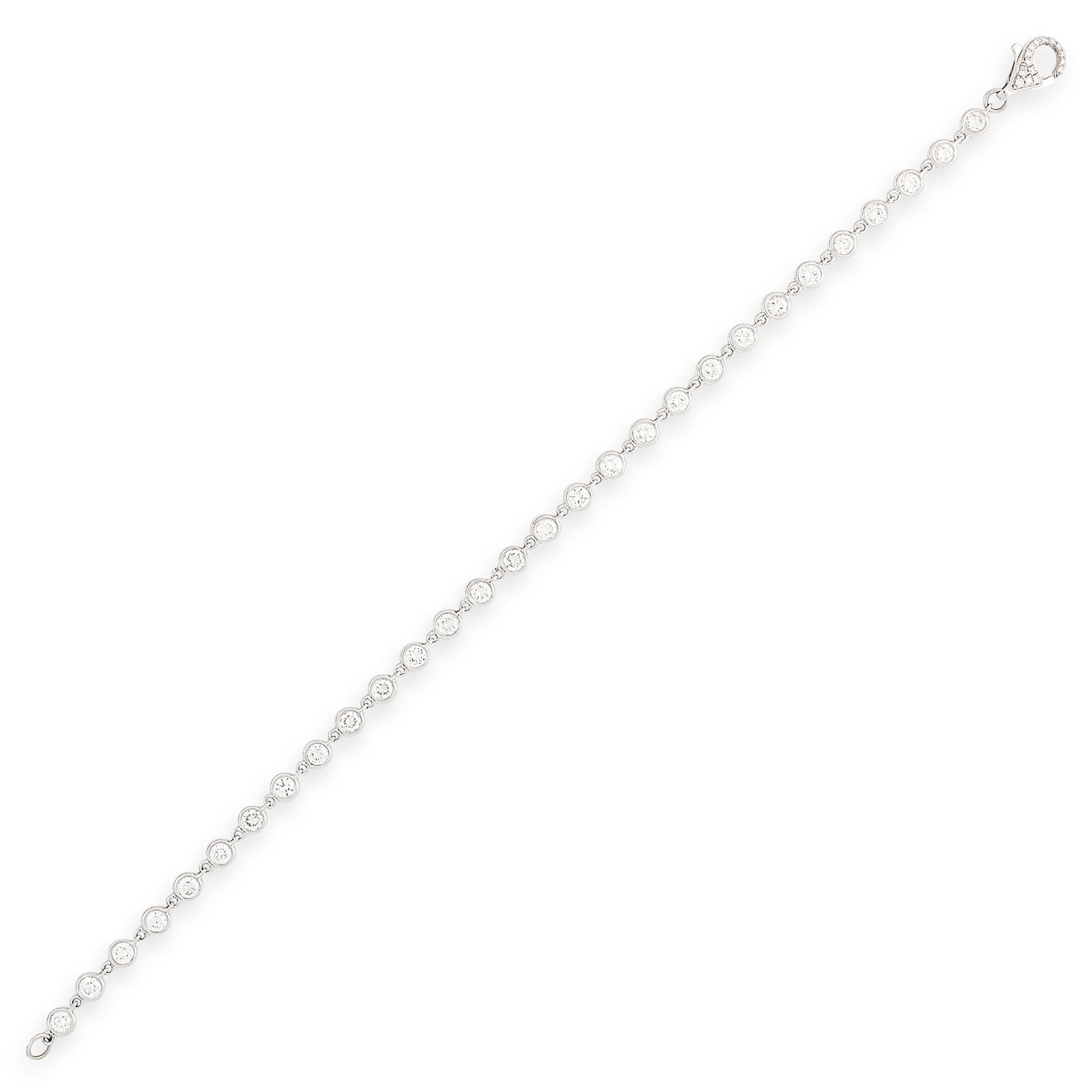 A DIAMOND LINE BRACELET in 18ct white gold comprising a single row of round cut diamonds, with