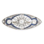 AN ART DECO DIAMOND AND SAPPHIRE BROOCH in platinum, of navette design, the body set with a trio