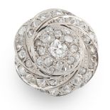 A DIAMOND DRESS RING in platinum, designed as a swirling motif, set with old and round cut