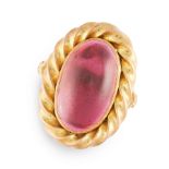 A GARNET DRESS RING in high carat yellow gold, set with a cabochon garnet in a twisted gold