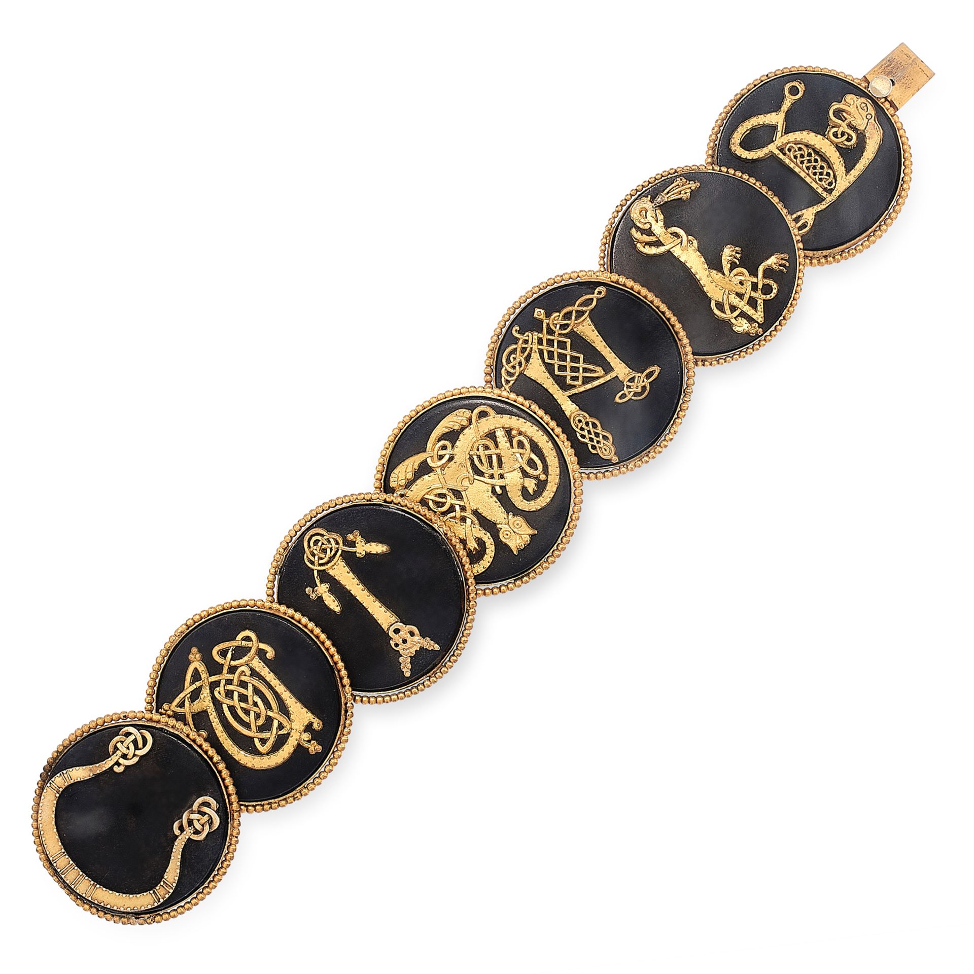 AN ANTIQUE IRISH BOG OAK BRACELET, 19TH CENTURY in gilt metal, comprising seven overlapping circular