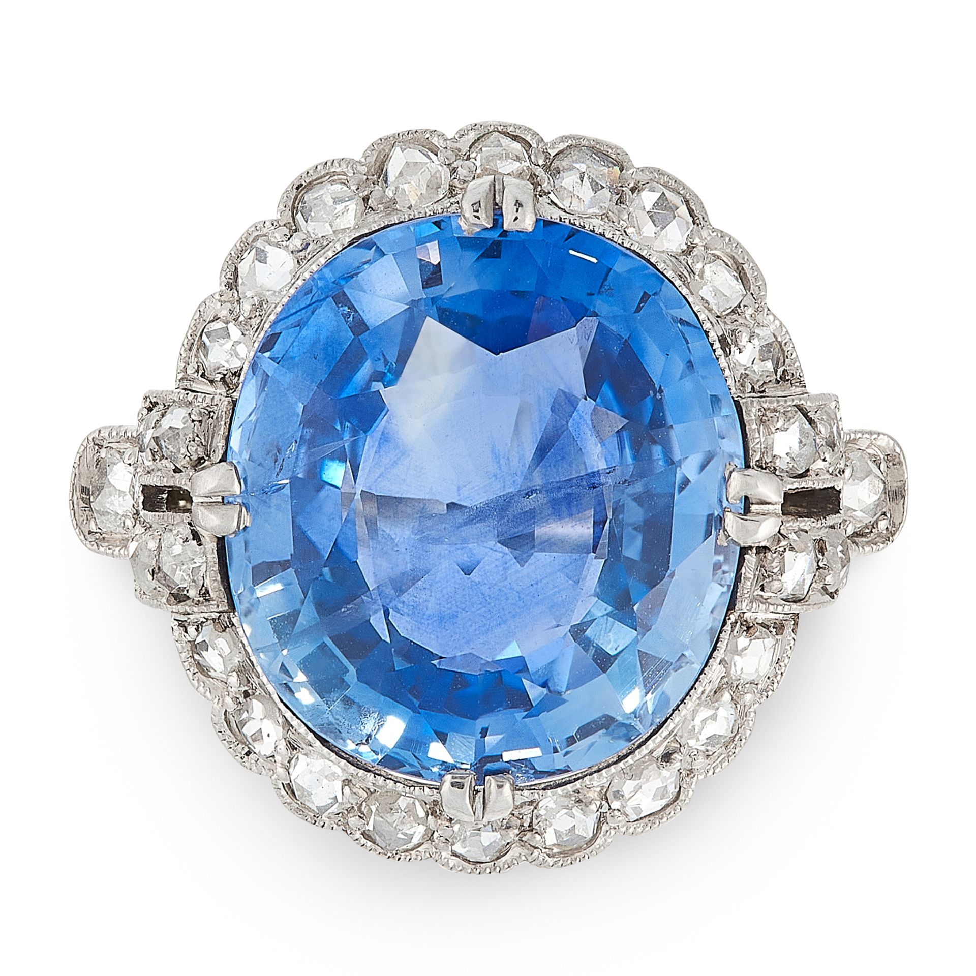 A 7.40 CARAT CEYLON NO HEAT SAPPHIRE AND DIAMOND CLUSTER RING in 18ct yellow gold, set with an