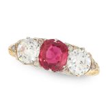 A RUBY AND DIAMOND THREE STONE RING in 18ct yellow gold, set with a cushion cut ruby of 1.12