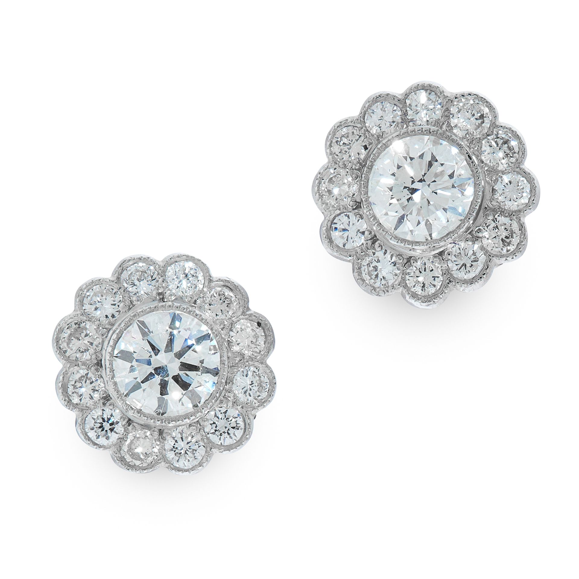 A PAIR OF DIAMOND CLUSTER STUD EARRINGS in 18ct white gold, each set with a round cut diamond within
