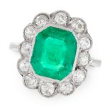 A COLOMBIAN EMERALD AND DIAMOND CLUSTER RING in 18ct white gold, set with an octagonal cut emerald