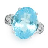 A BLUE TOPAZ AND DIAMOND RING in white gold, set with an oval cut blue topaz of 15.10 carats, the