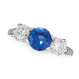 A SAPPHIRE AND DIAMOND THREE STONE RING in platinum, set with a round cut sapphire of 0.92 carats