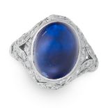 A SAPPHIRE AND DIAMOND RING in 18ct white gold, set with an oval cabochon sapphire within an open