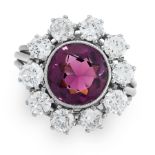 AN AMETHYST AND DIAMOND CLUSTER RING set with a round cut amethyst of 1.53 carats within a cluster