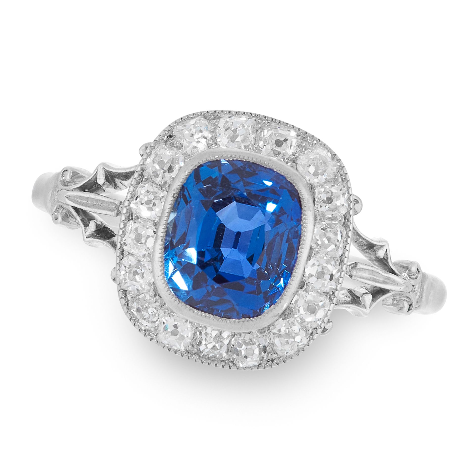 A CEYLON NO HEAT SAPPHIRE AND DIAMOND RING set with a cushion cut sapphire of 2.20 carats, within