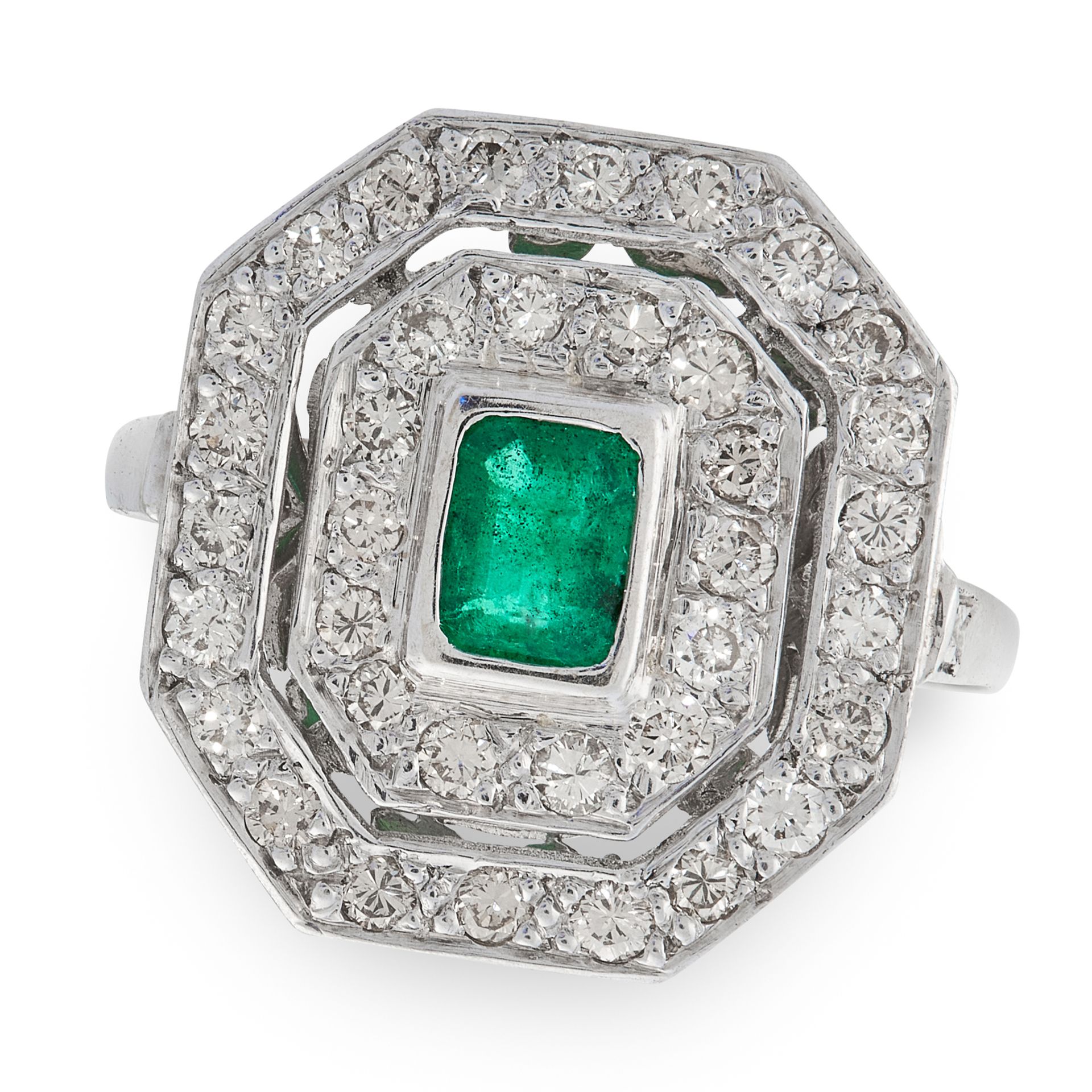 AN EMERALD AND DIAMOND DRESS RING in platinum, set with an emerald cut emerald within a two row