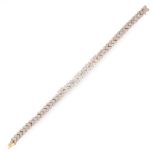 A DIAMOND BRACELET in 18ct yellow gold, set with nine central trios of round cut diamonds and