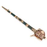 AN ANTIQUE SCOTTISH HARDSTONE KILT PIN in yellow gold, designed as a sword, set with a bloodstone