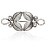 A VINTAGE BROOCH in silver, set with four leaf motifs and scrolling shoulders, stamped sterling