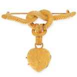 AN ANTIQUE MOURNING LOCKET BROOCH, 19TH CENTURY in 18ct yellow gold, designed as a lovers' knot