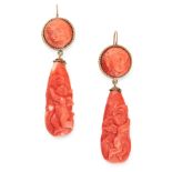 A PAIR OF ANTIQUE CORAL CAMEO DROP EARRINGS in yellow gold, each set with a carved and polished