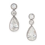 A PAIR OF DIAMOND DROP EARRINGS in 18ct white gold, each set with a pear cut diamond suspended below