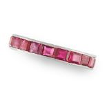 A RUBY ETERNITY RING in platinum, set with a single row of step cut rubies, French assay marks, size