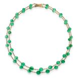 A JADEITE JADE BEAD NECKLACE in yellow gold, comprising two rows of jadeite beads ranging 9.0mm to