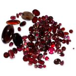 A MIXED LOT OF UNMOUNTED GARNETS of various shapes and cuts, together with a small quantity of other