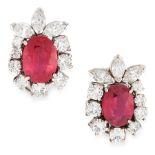 A PAIR OF RUBY AND DIAMOND EARRINGS each set with an oval cut ruby within a border of round and