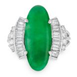 A NATURAL JADEITE JADE AND DIAMOND RING in platinum, set with an elongated oval jadeite cabochon