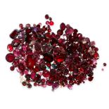 A MIXED LOT OF UNMOUNTED GARNETS of various shapes and cuts, together with a small quantity of other