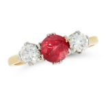 A RUBY AND DIAMOND THREE STONE RING in high carat yellow gold, set with a round cut ruby of 1.09